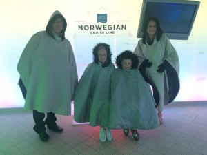 family with coats on in Ice Bar